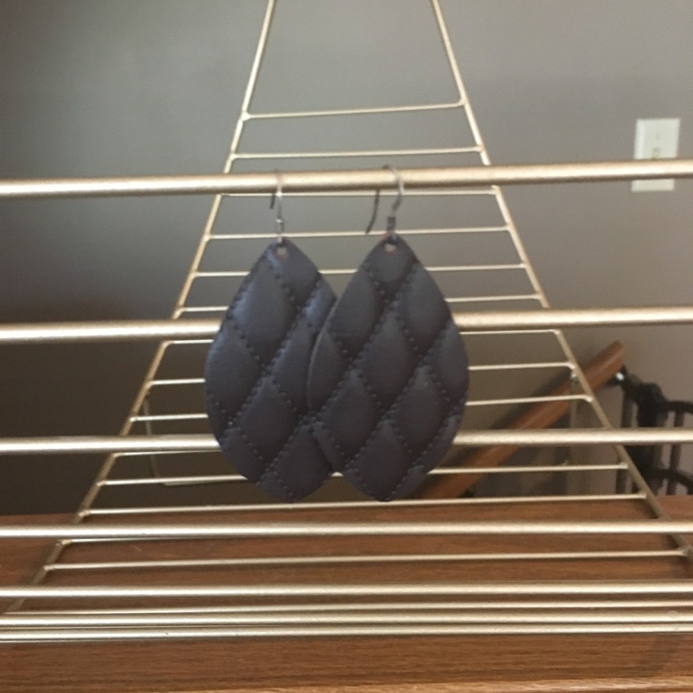 Dark brown leather teardrop earrings.